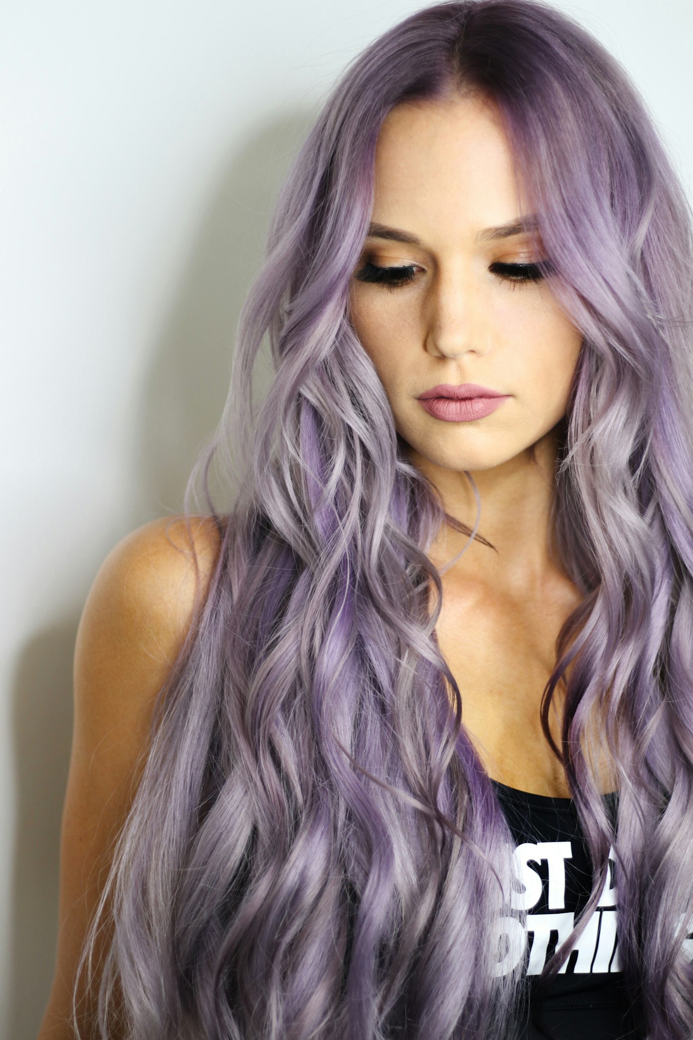 Long, lightened hair styled into soft waves